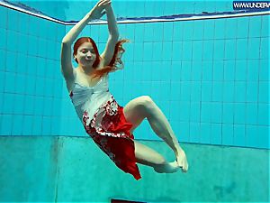 super-hot polish redhead swimming in the pool